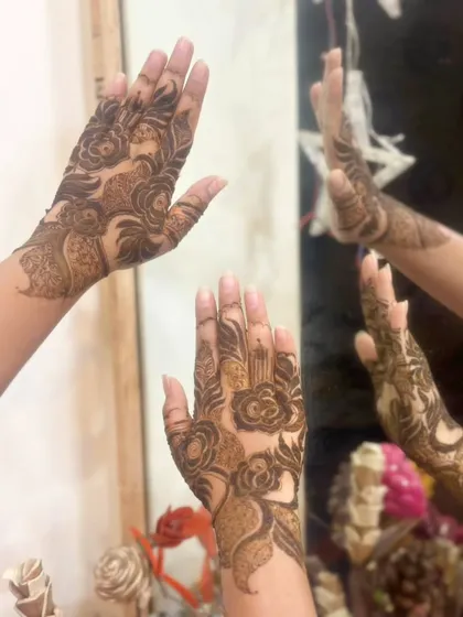A beautiful mirror shot of the bold rose henna, showcasing its artistic flair.