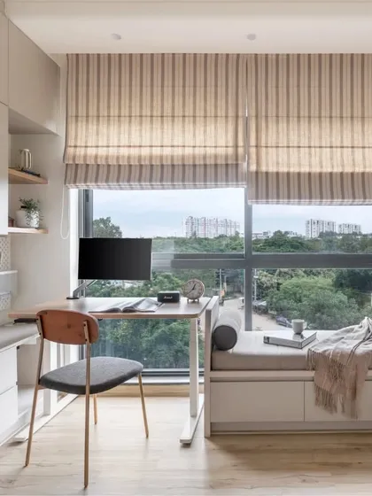 My designs turn every corner into a useful and beautiful space. This multifunctional room combines a cozy bay window seat with a streamlined study nook, complete with custom wicker-paneled wardrobes, showcasing my approach to smart, space-saving solutions.