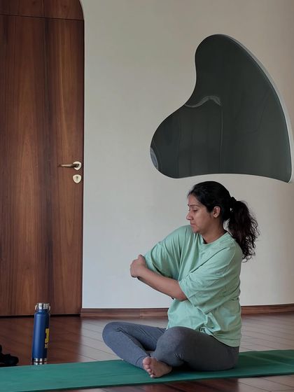 A simple, seated arm stretch can provide immense relief. I teach small, mindful movements like this to help you manage the daily aches and pains of pregnancy.
