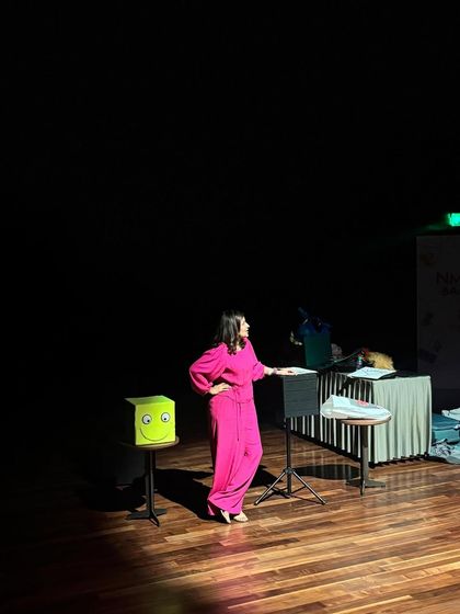 On stage with my props, including the smiley-face box, ready for an hour of fun and ventriloquism.