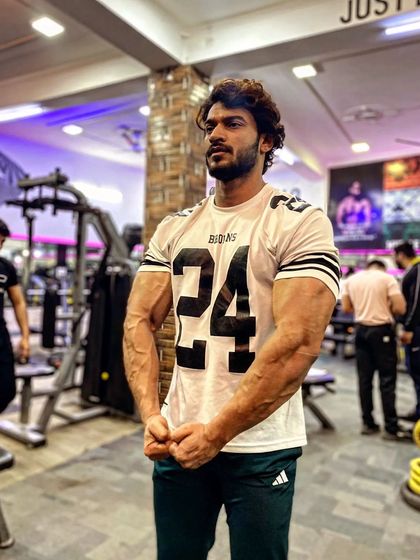 A simple, powerful arm pose. The veins and muscle definition are a roadmap of the work that's been put in.