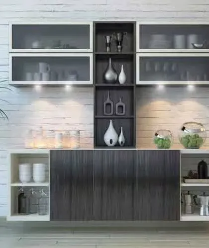 A floating crockery unit with a modern black and white design. The unit features frosted glass doors and under-cabinet lighting, creating a stylish display and storage piece for a dining area.