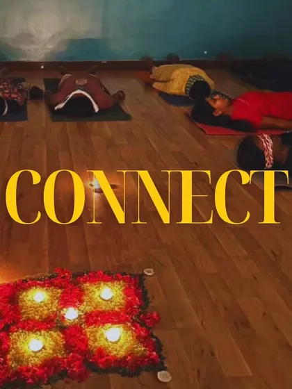 A moment of connection, both with oneself and with the healing vibrations in the room. The candlelit mandala creates a focal point for this shared intention.