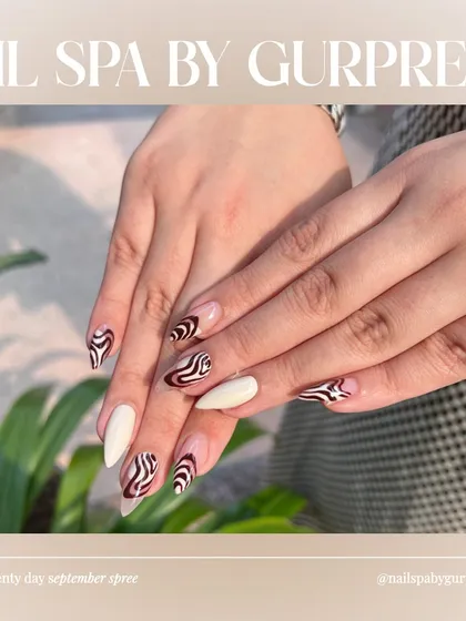 Custom nail art is my passion. This design combines a sharp, stiletto shape with a trendy zebra print and a negative space technique. It’s a perfect example of how I mix different styles to create something truly unique and modern for my clients.