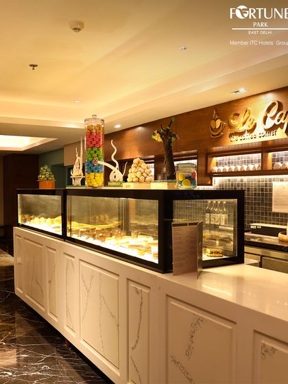 Our pastry and confectionery display at Le Cafe. We offer a tempting array of cakes, sweets, and savories to accompany your coffee or tea.