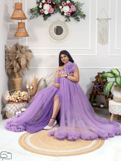 A stunning solo portrait in the lavender gown. The slit adds a touch of modern glamour to the romantic, ruffled dress.