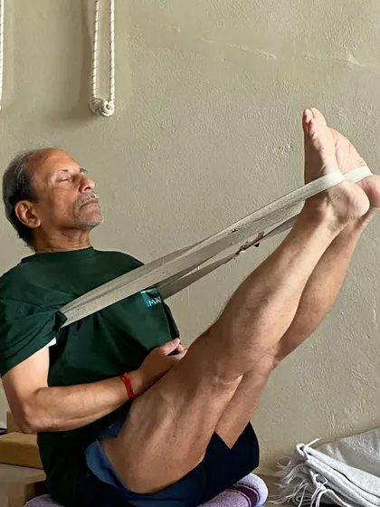 Navasana (Boat Pose) with a strap.