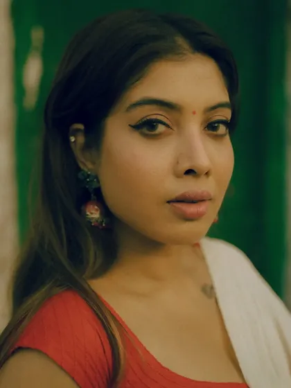 A series from an outdoor shoot, using a rustic green door as a complementary background for the red and white saree. These images show how I use color theory and natural environments to compose a shot.