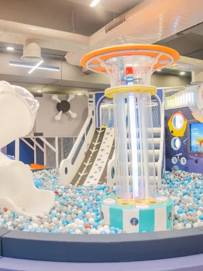 A glimpse of our main play area, featuring the huge ball pit, slides, and a central tower. It's a safe, clean, and vibrant space designed for hours of climbing, sliding, and adventure.