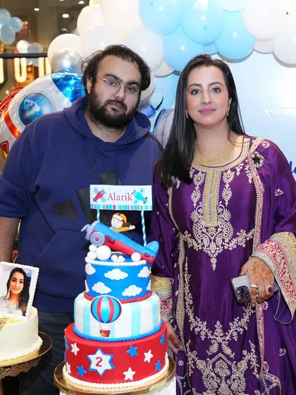 A lovely family photo of the clients with the birthday cake and our decoration. Creating the backdrop for these precious memories is an honor.