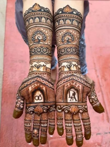 An elegant engagement design featuring the couple's initials and a wedding ring motif, surrounded by peacock and swan patterns.