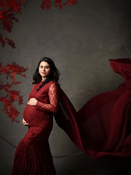 Here, I've added a subtle circular frame and floral elements to the composition, creating a fine art maternity portrait.