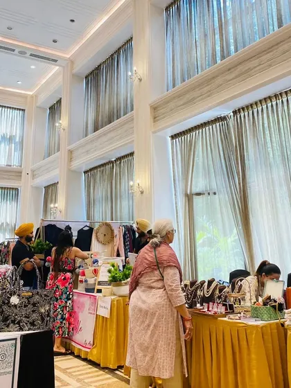 A beautiful, sunlit hall at Central Park Resorts filled with shoppers. The premium venue itself is a major draw for visitors.