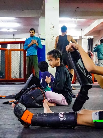 Young fighters getting ready for class. We teach them discipline and respect for the art from the moment they step on the mats.