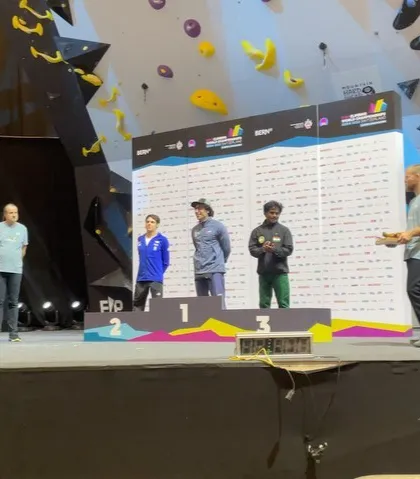 Standing on the third-place podium during the medal ceremony at the World Championship in Bern. The atmosphere at these international events is electric, and I strive to bring that same energy to our local competitions.