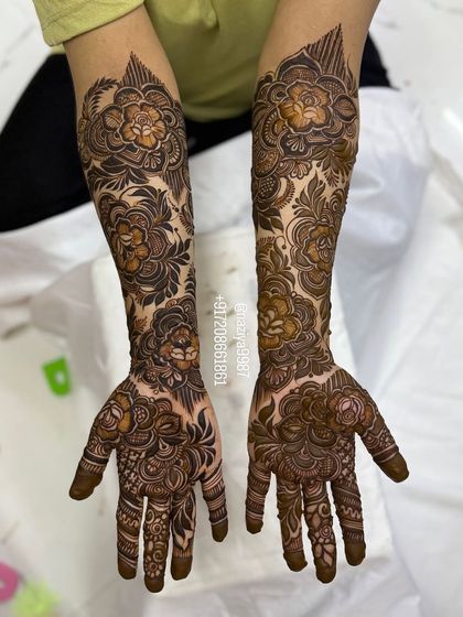 A full view of the symmetrical floral design on both arms. This is a classic and timeless look for any bride.