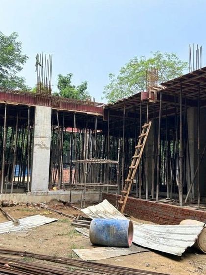 Another view of the Shantiniketan site, showing the progress of the structural work. These early stages are crucial for establishing the foundation of the design.