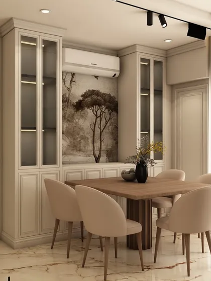 The adjoining dining area is designed for intimate gatherings, featuring built-in crockery units with glass doors and a mural that continues the nature theme from the living room.