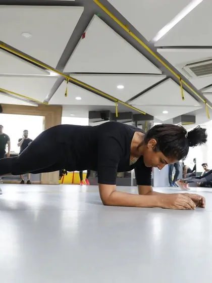 A participant holds a perfect plank during our gym-wide challenge. We host regular events like this to bring our members together, test their limits, and foster a sense of friendly competition.