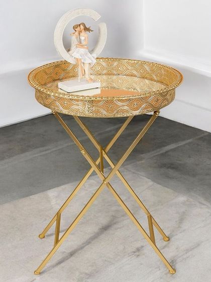 A similar design with a round tray top. These gold-finished butler tables are perfect for serving drinks or as a decorative accent, adding a touch of glamour to any corner.