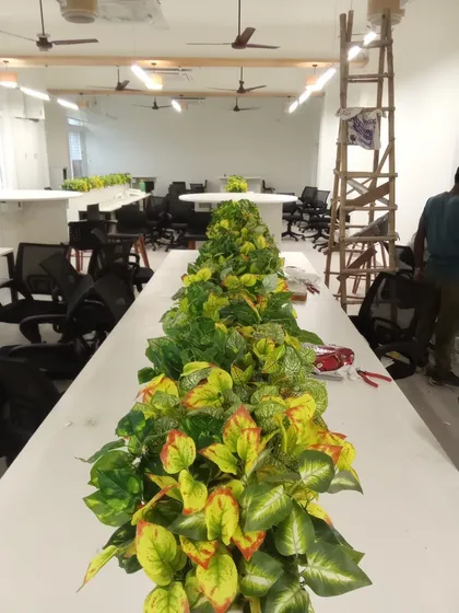 Another view of the office desk planter installation, showing how it adds a line of green to the workspace.