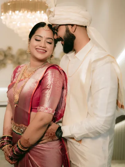An intimate portrait of a South Indian couple, capturing the warmth and happiness in their embrace.