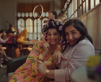 A fun scene from the Arihant app commercial. This project required a variety of character looks, including this playful one with hair rollers and bright makeup.
