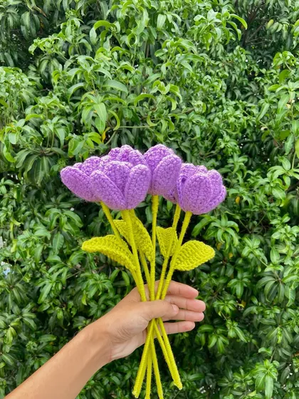 A handful of delicate purple tulip stems.