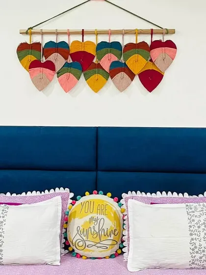Bringing nature indoors. Our handcrafted macrame leaf hanging finds a perfect home above the bed in this stunning setup created by our client.
