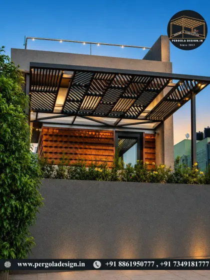 A stunning evening shot of a rooftop pergola. The structure features a unique patterned ceiling with integrated lighting, creating a warm and inviting glow.
