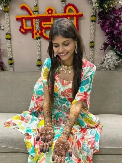 Another happy moment captured, with the bride looking down at her beautiful mehandi.