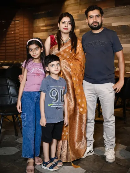 A family portrait taken at a restaurant birthday party. I am experienced in shooting in various indoor venues across Delhi NCR.