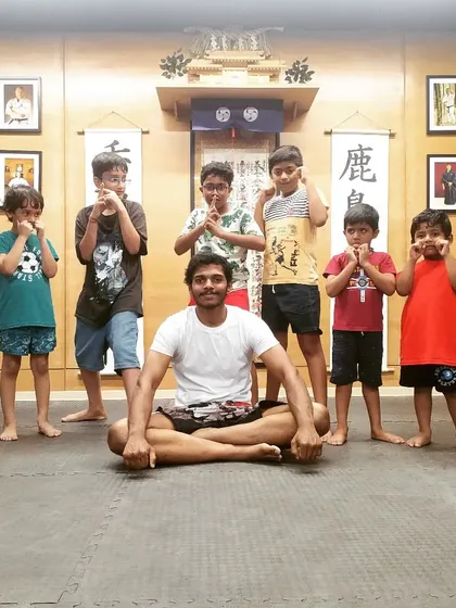 We work hard, but we also have fun. A little bit of attitude and a strong pose after a tough kickboxing class at The Dojo.