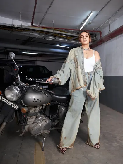 We created this raw, grunge moment with Huma Qureshi. It's all about the rust, denim, and attitude, with distressed layers from Huemn and silver accents to tie the wild energy together.