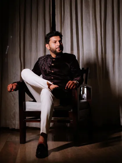 Duplicate of image 419, a moody and stylish groom portrait.