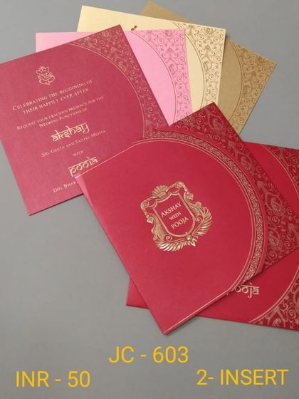 A classic red invitation with a semi-circular flap and a gold crest. This affordable set includes inserts in multiple colors for a traditional and festive feel.