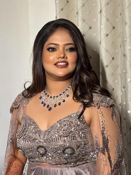 A beautiful smile from a happy client wearing our sapphire-toned American diamond necklace. It's a perfect rental for adding a pop of colour to an evening outfit.