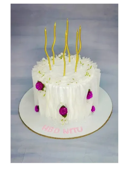 An elegant white wafer paper cake with delicate purple flowers. This fresh pineapple cake is a minimalist yet stunning choice for any celebration.