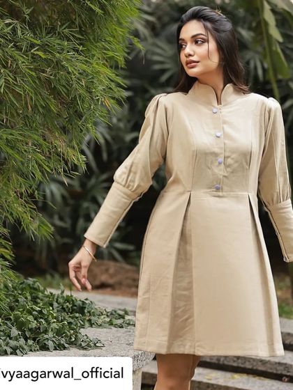 A full-view shot of the structured jute linen dress, showcasing its clean design and modern aesthetic. This piece is a testament to our belief in understated elegance.