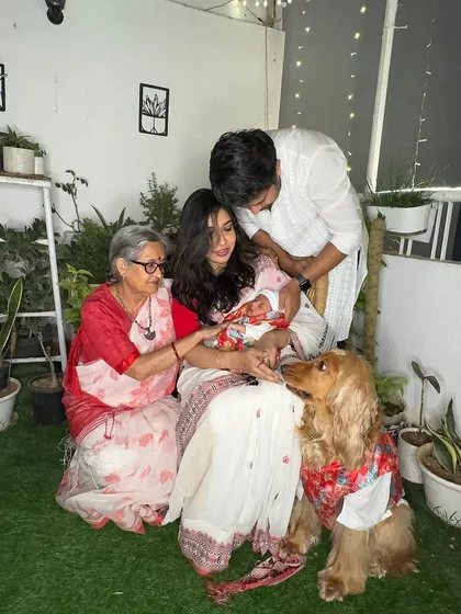 The whole family showering love on the newest member during his first Diwali.