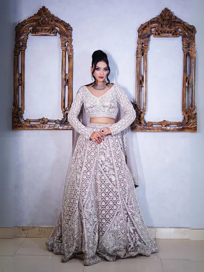This pastel lavender lehenga with intricate white embroidery is perfect for a sophisticated and modern look.