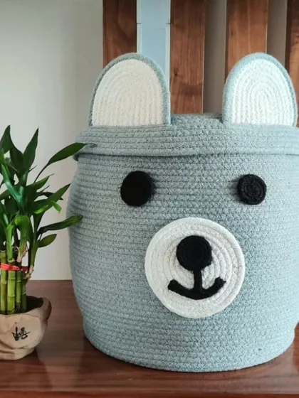A close-up of the grey bear basket, showing the texture of the cotton rope and the cute, simple face design.