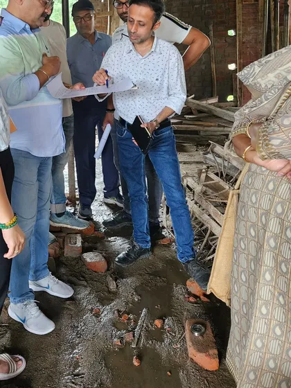 Inspecting the foundational work of a new building. The energy grid is established at this stage, so precision is key.