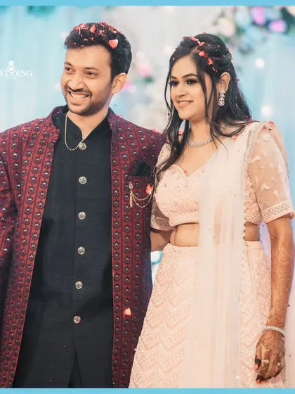 Weaving together love and timeless memories. A beautiful portrait of the newly engaged couple, showered in petals.