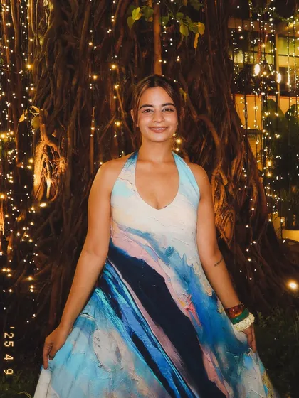 Posing in my favorite wave dress against a backdrop of fairy lights. This dress is not just an outfit; it's a feeling of confidence and beauty.