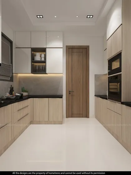This view shows the U-shaped layout of the kitchen, with built-in appliances and ample counter space.