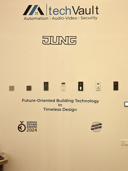 This display wall from an expo showcases the future of building technology with JUNG keypads. Their timeless German design is recognized with awards for its form and function.