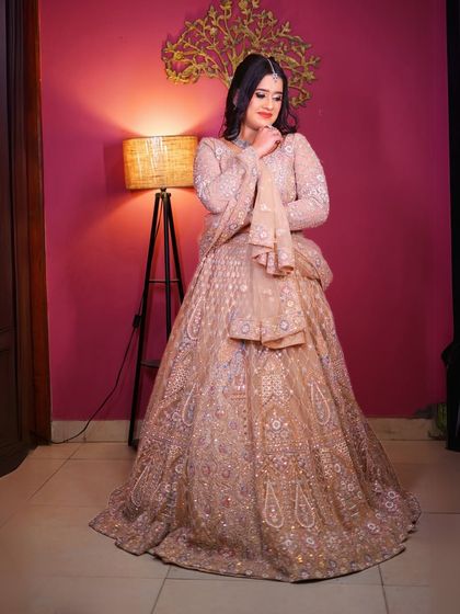 A full-length view of the beige lehenga, showing its complete design.