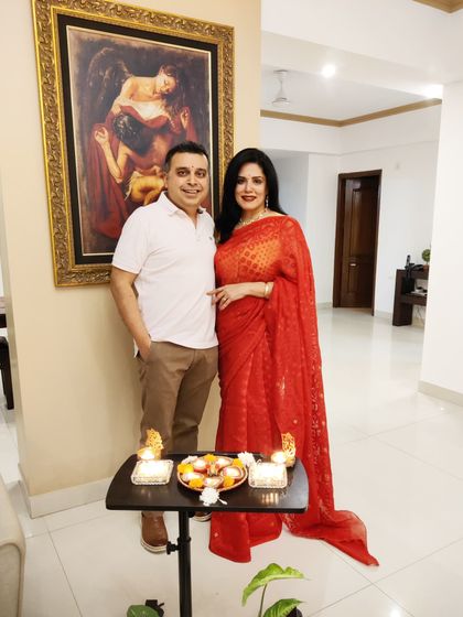 Celebrating Diwali at home with my main man. A classic red saree is always a wonderful choice for bringing in the festival of lights with joy and tradition.