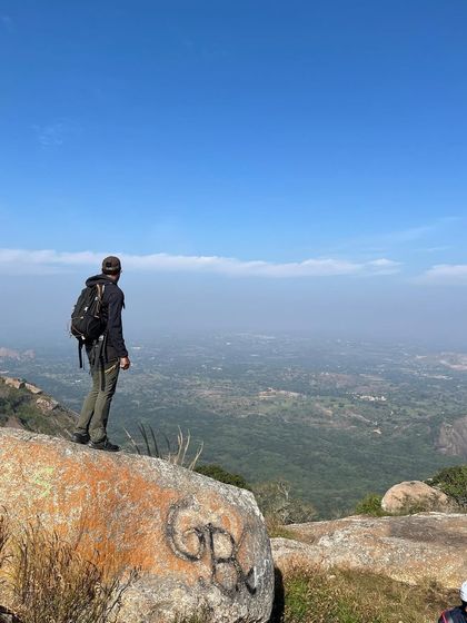 A moment of quiet reflection overlooking the expansive landscape from Savandurga hill. The views from the top are always worth the climb.
